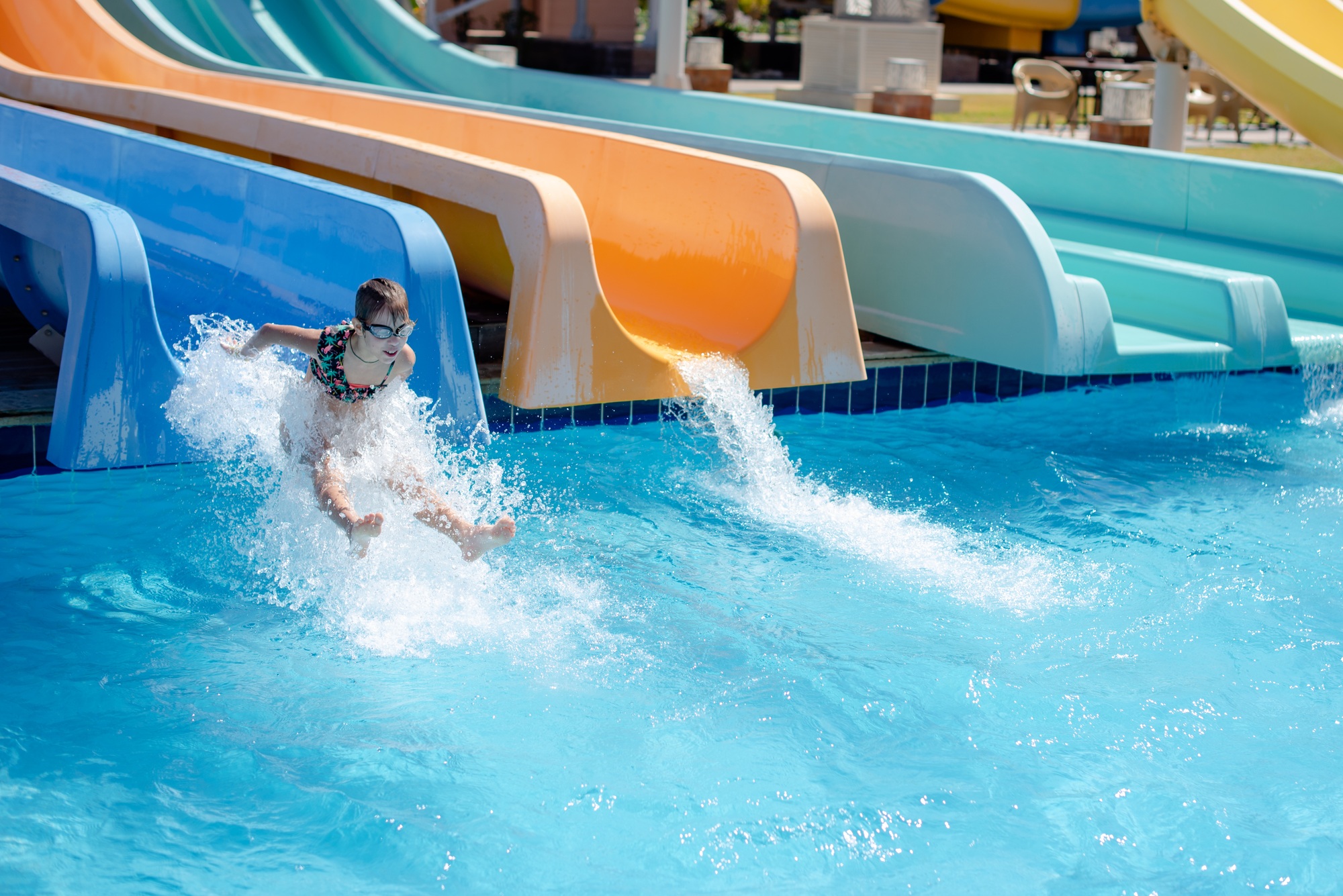 the child is riding on water slides. aquapark